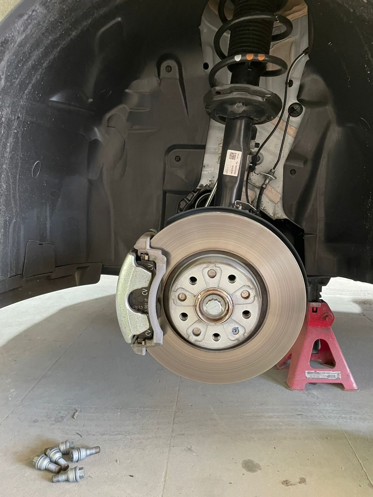 Before caliper paint — bare grey