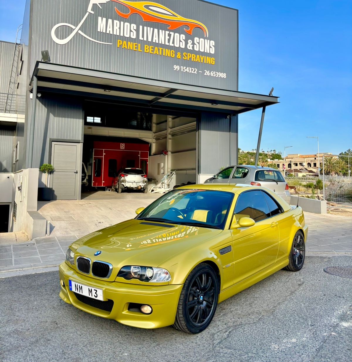 Yellow BMW M3 outside Livanezos workshop